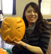 Chelsea Liu '13 at the International Students, Scholars, and Programs pumpkin carving event.